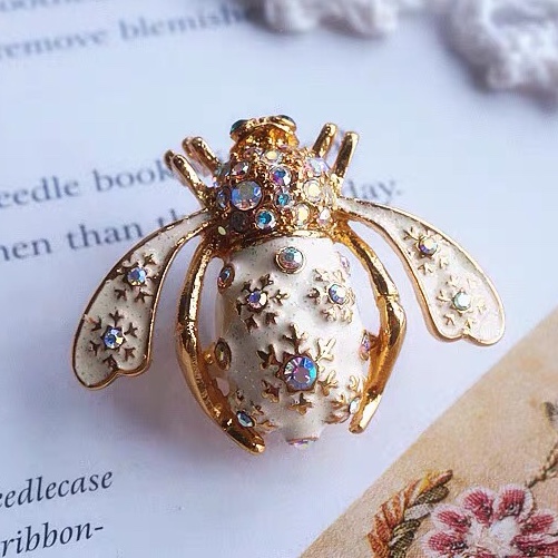 Snowflake beetle brooch