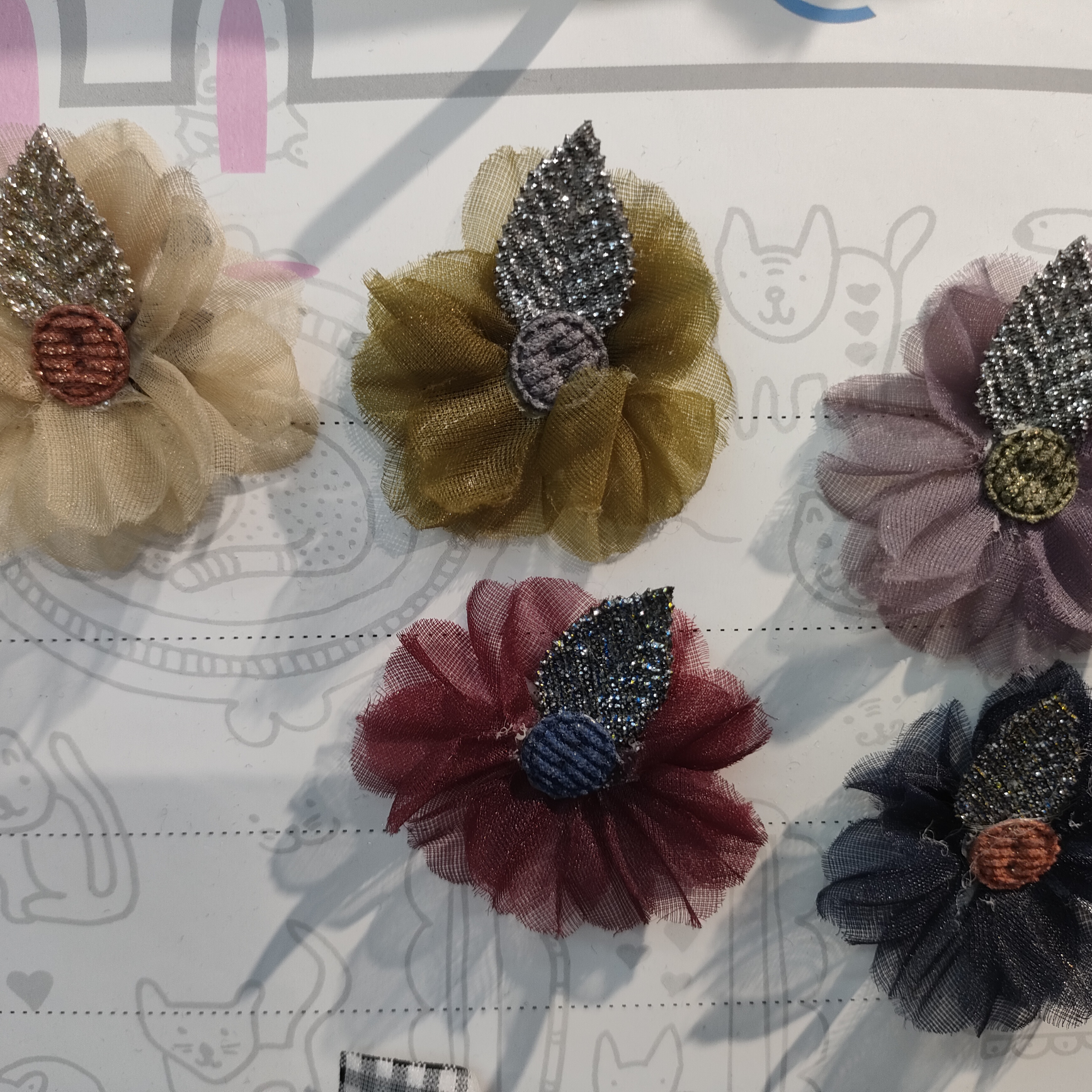 Yarn flowers sticky leaves