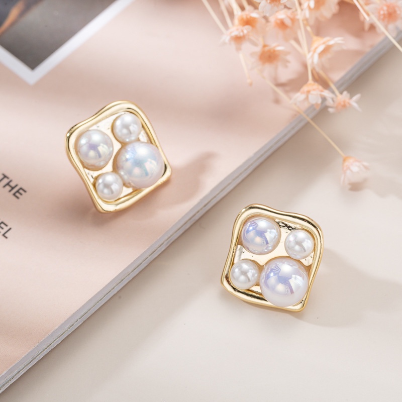 Square metal pearl earrings, delicate and small.