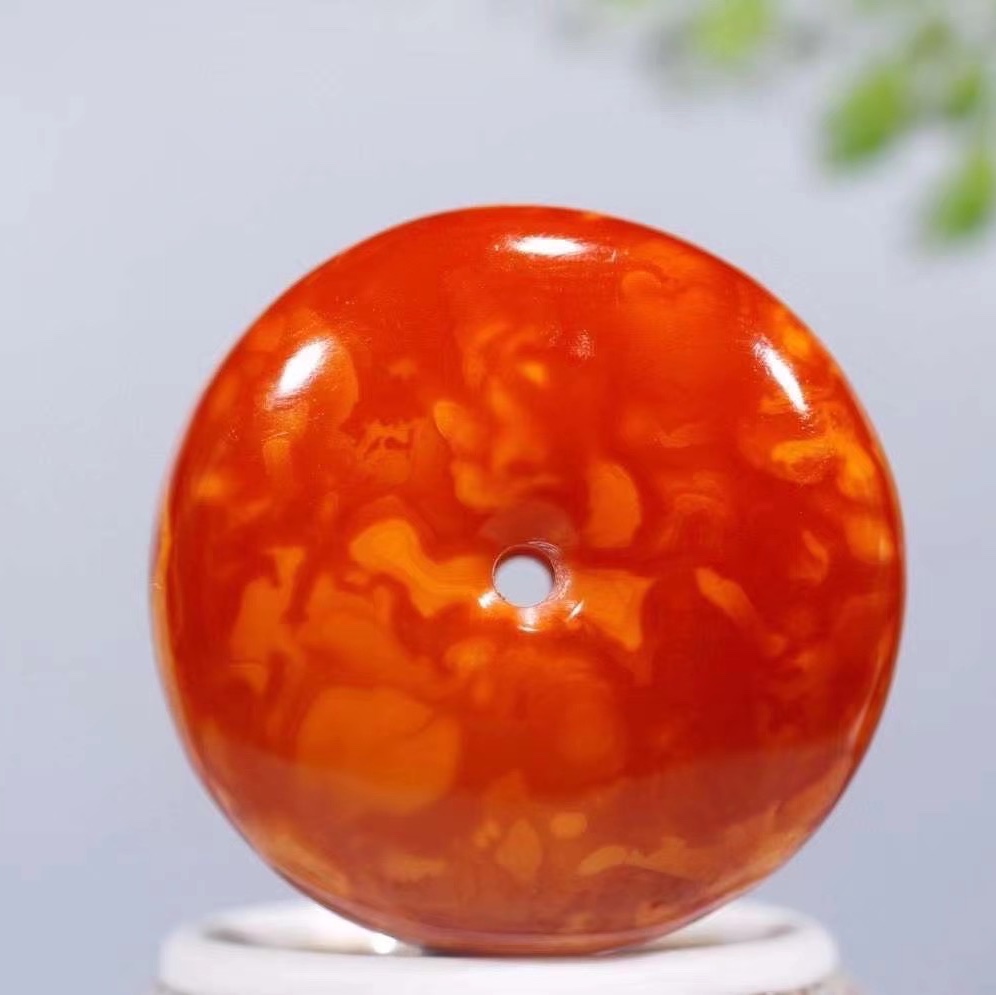 Old peace pendant in chicken oil red
