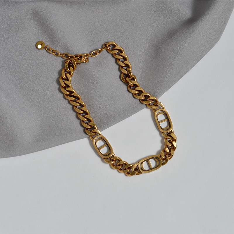 A three-piece set of chain letter necklace, bracelet and ring, with a high-end, retro and aged metal style. It's a trendy collarbone chain Application Scenario