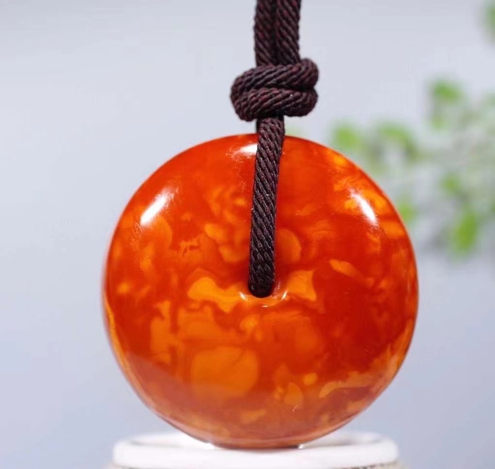 Old peace pendant in chicken oil red detail image 2