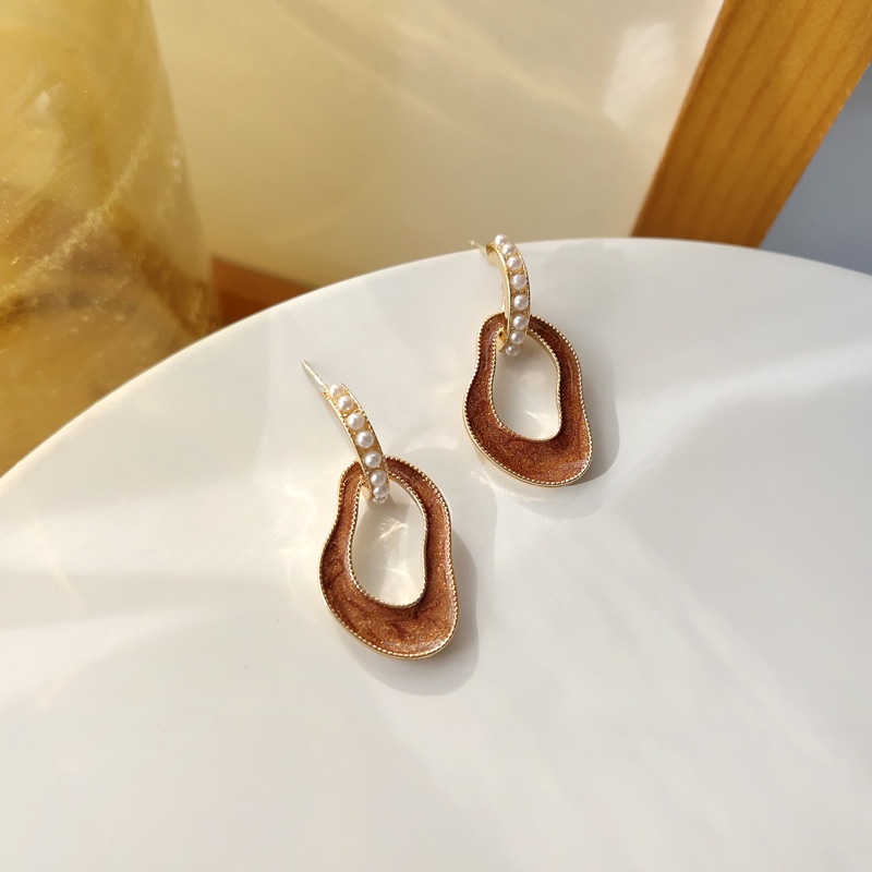 Vintage amber earrings, artistic elegance.