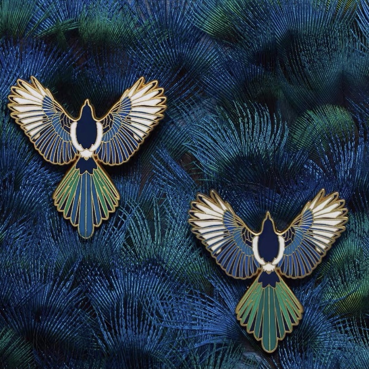 Flying pigeon brooch