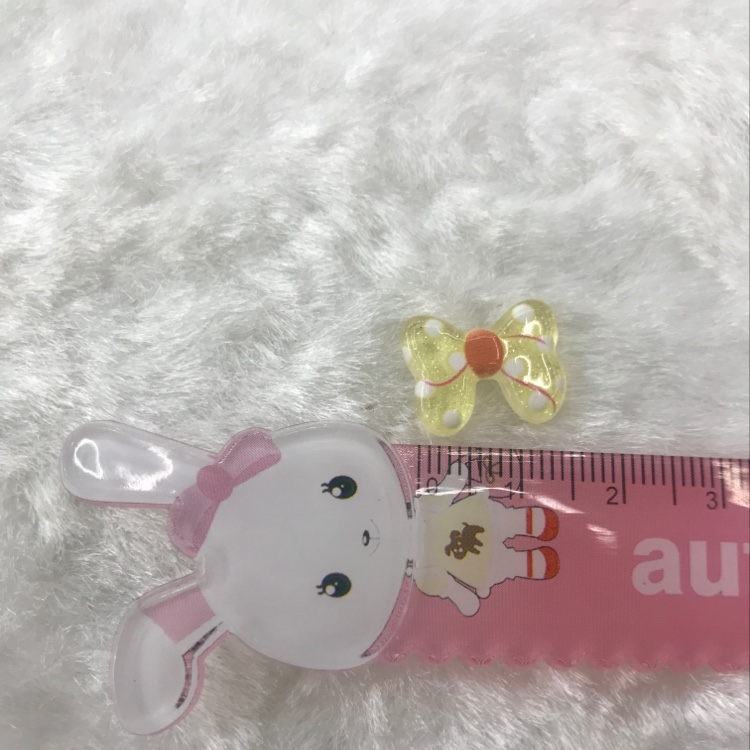 A cute and fresh girl with a yellow polka dot bow details Picture