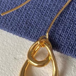 Lustrous double teardrop earrings with ear hooks