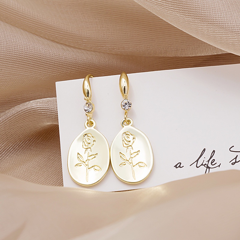 Cubic peach blossom zircon earrings, elegant temperament.