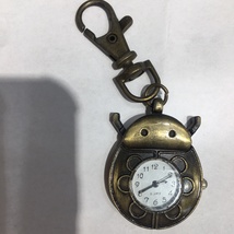 古铜色钥匙扣手表100