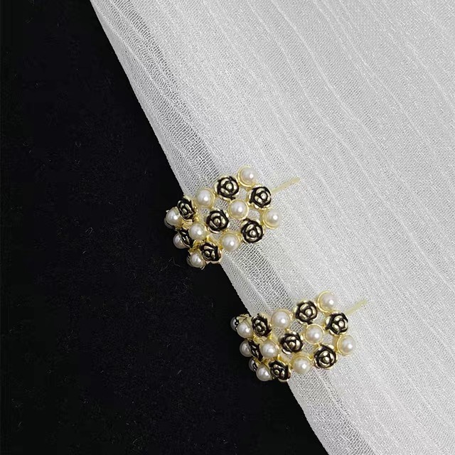 Black flowers with pearl stud earrings