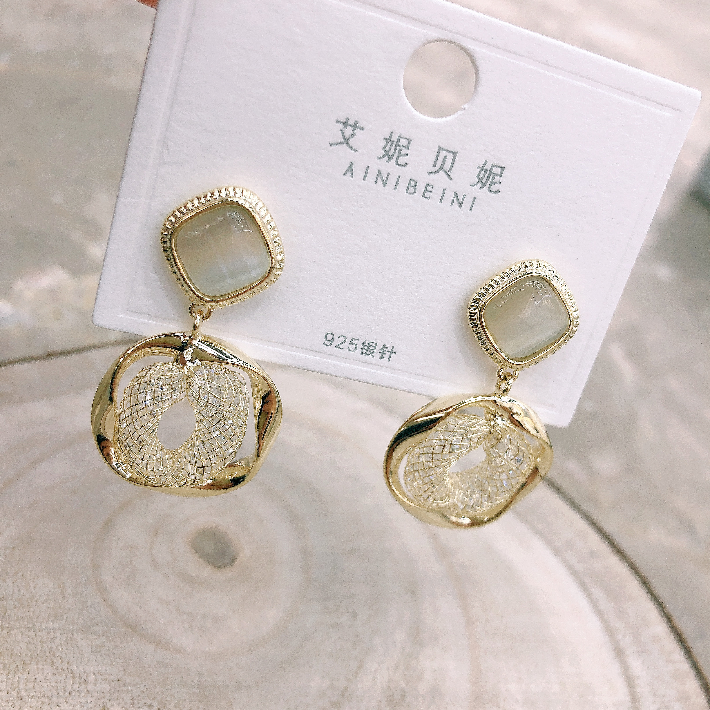 Elegant cat's eye stone crystal woven retro style trendy and individual women's earrings Item Picture