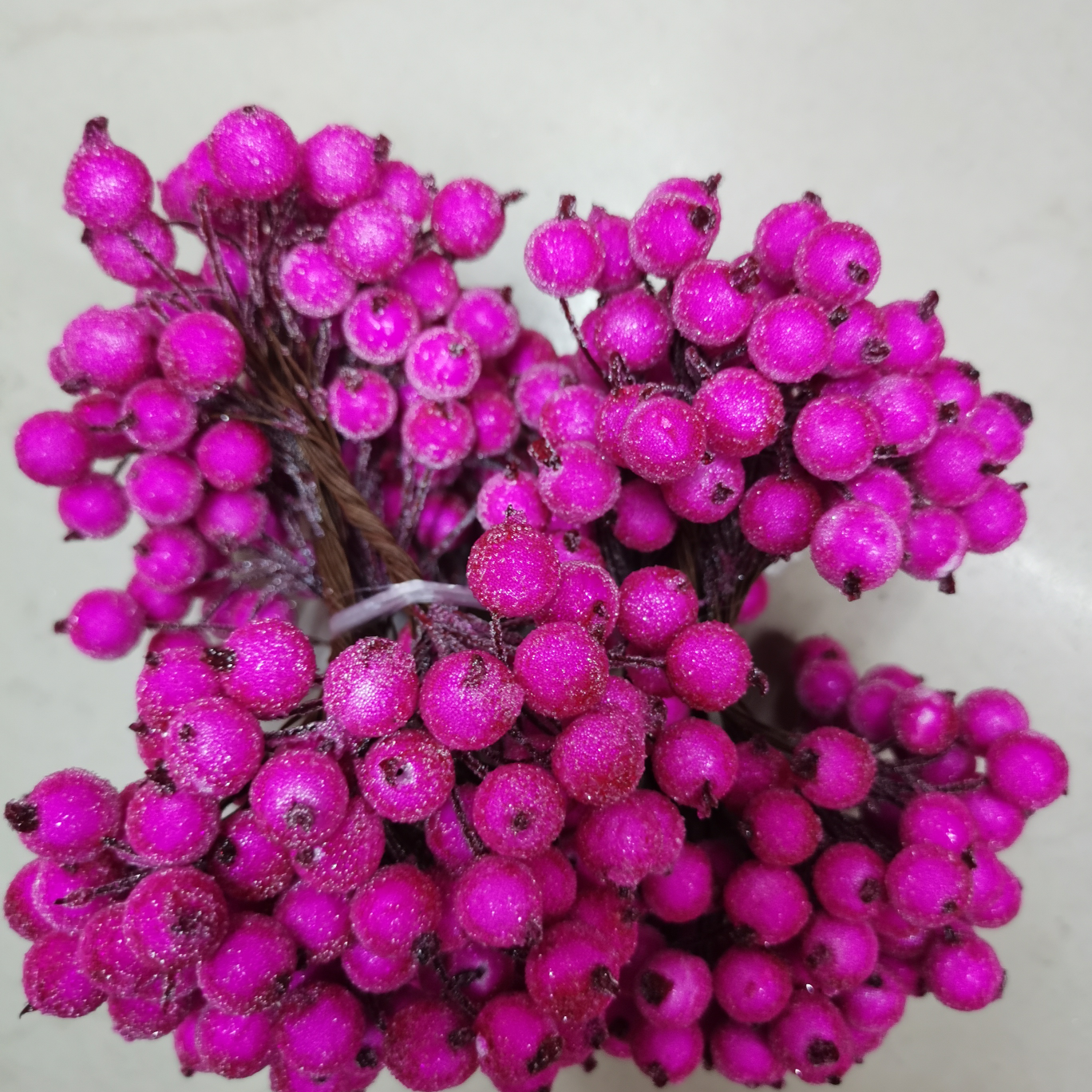 The glass fruit is light rose red