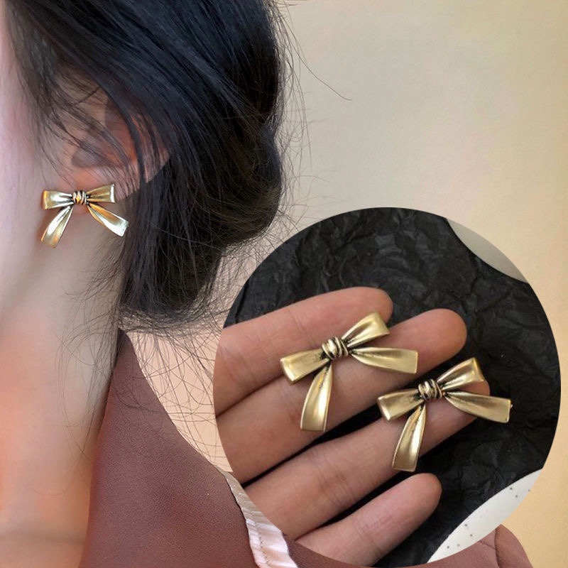 Retro bow earrings, women's silver needles, elegant forest style, girlish heart, student style, new stud earrings, unique personality