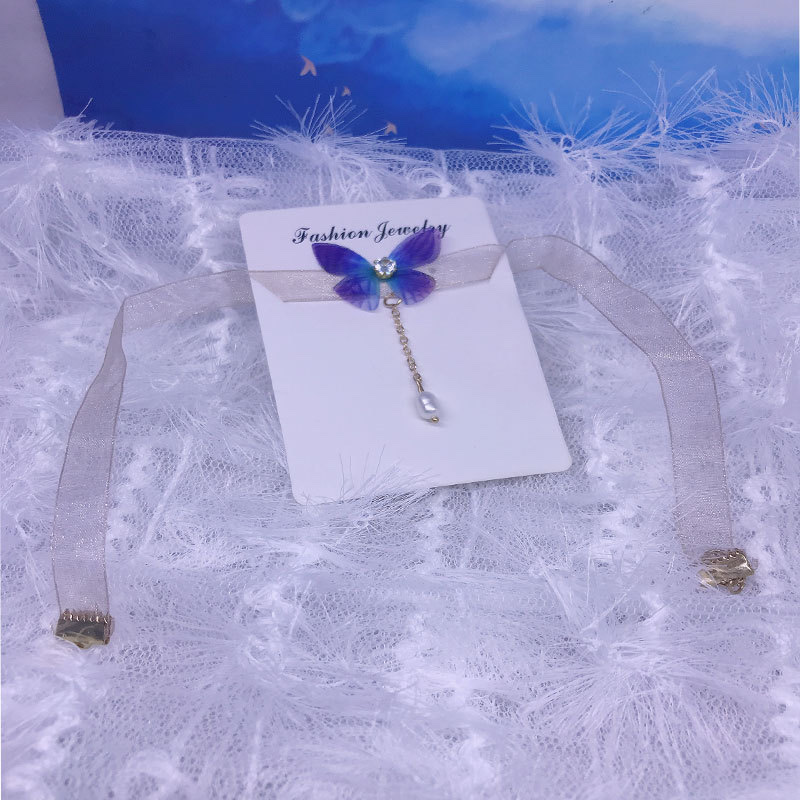 The butterfly in the dream, with a transparent gauze ribbon and glittering diamonds, is a fashionable and elegant pearl zircon short necklace Specification image