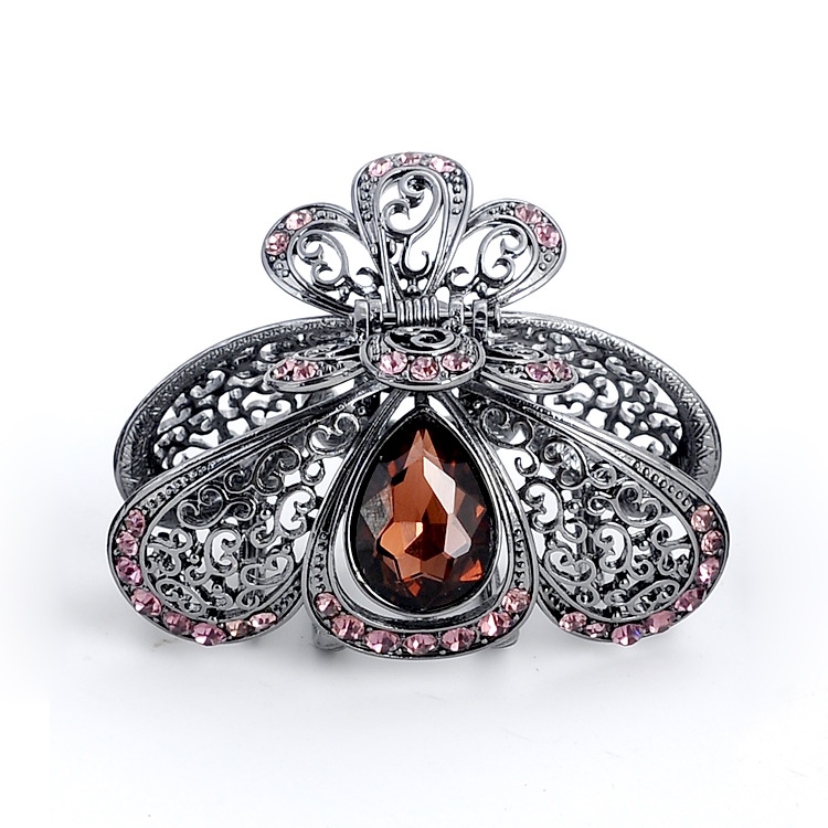 A black lady's hairpin with a teardrop-shaped hollowed-out grab, an Amazon alloy headpiece