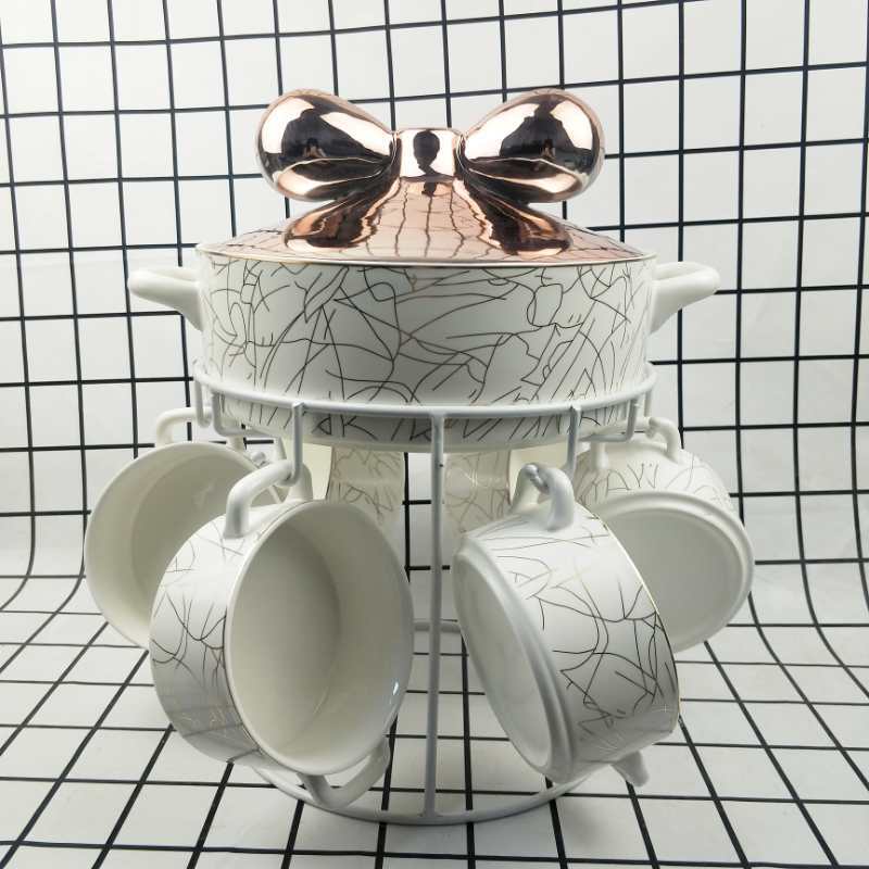 Nordic light luxury small soup pot with a golden stand set, bow at the exit, embossed and gilded ceramic daily-use soup pot Item Picture