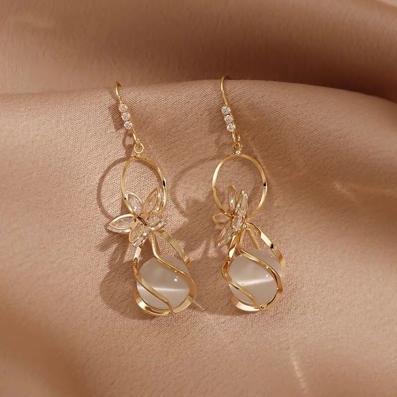 Vintage fashion trend influencer with the same holiday must-have earrings