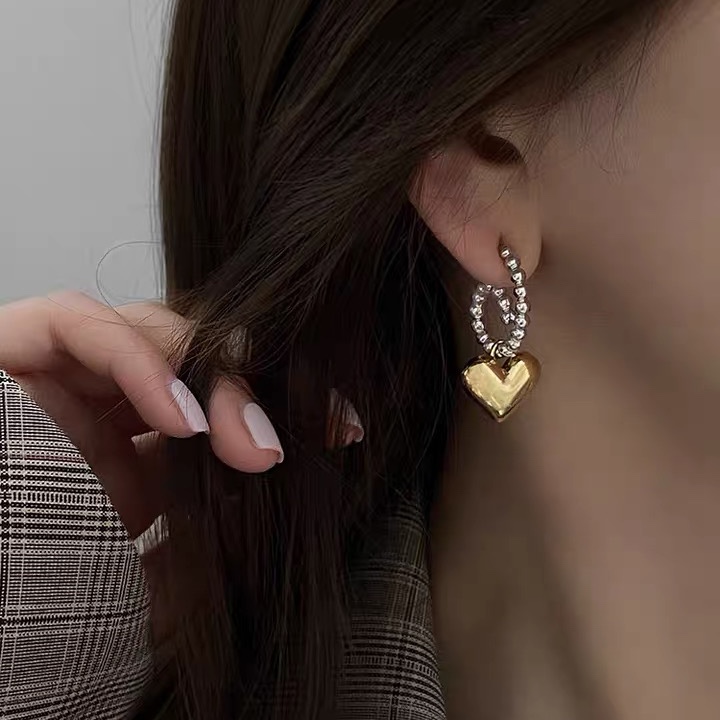 The ear buckles are adorned with hearts