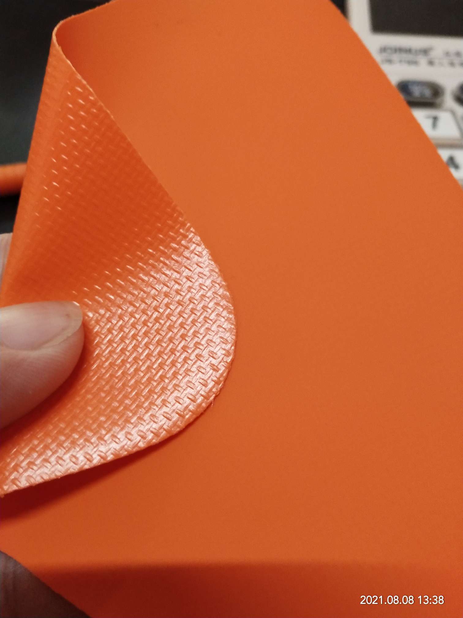 High-quality matte 0.55mm thick orange PVC mesh fabric for luggage, machine covers, furniture covers, sports and amusement products, various gymnastic MATS, and special fabric for various luggage bags details Picture