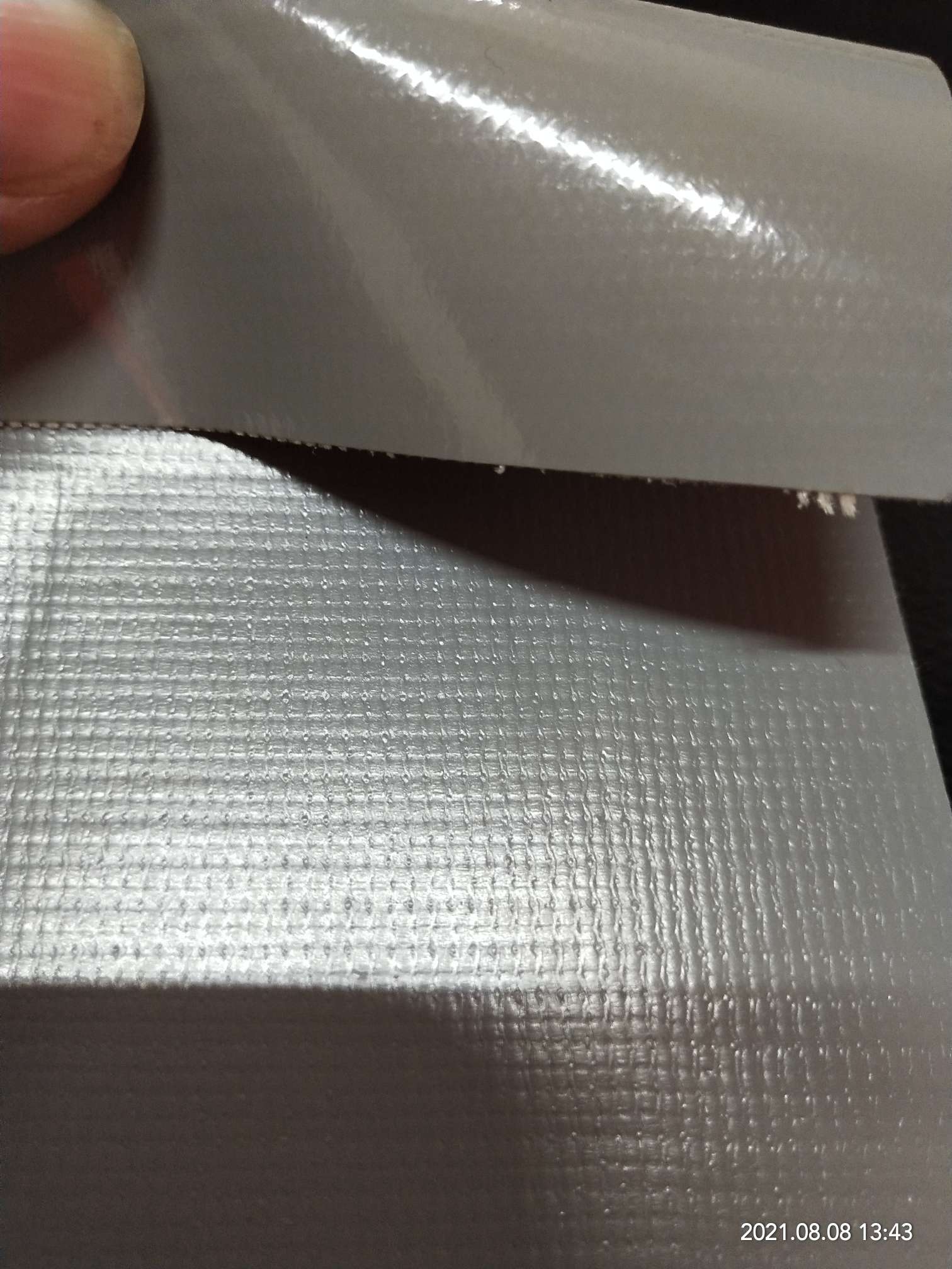 High-quality glossy 0.5mm thick grey PVC mesh fabric for luggage, machine covers, furniture covers, sports and amusement products, and various types of luggage Item Picture