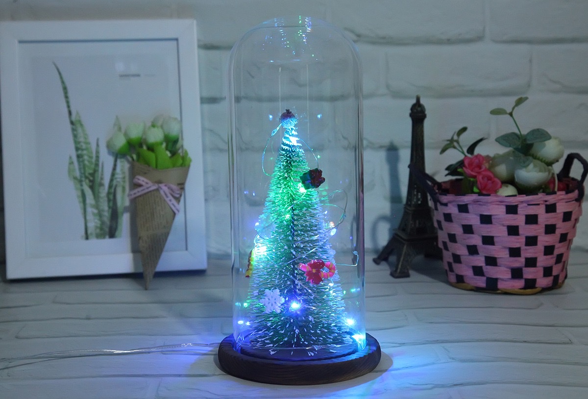 A large artificial Christmas tree with a transparent dust-proof glass cover is a home decoration for the living room and bedroom detail image 4