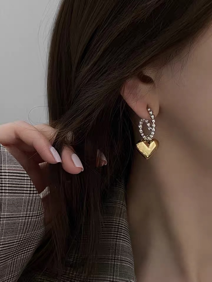 The ear buckles are adorned with hearts details Picture