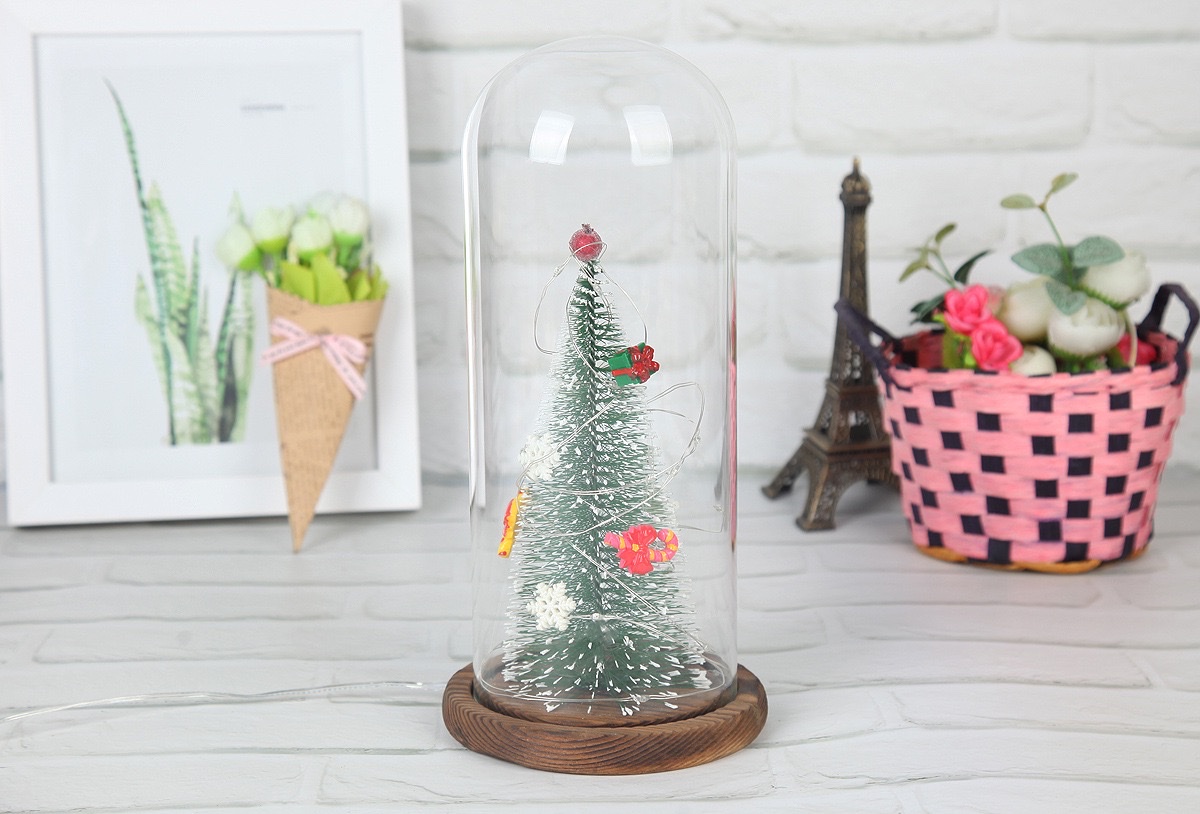 A large artificial Christmas tree with a transparent dust-proof glass cover is a home decoration for the living room and bedroom detail image 2