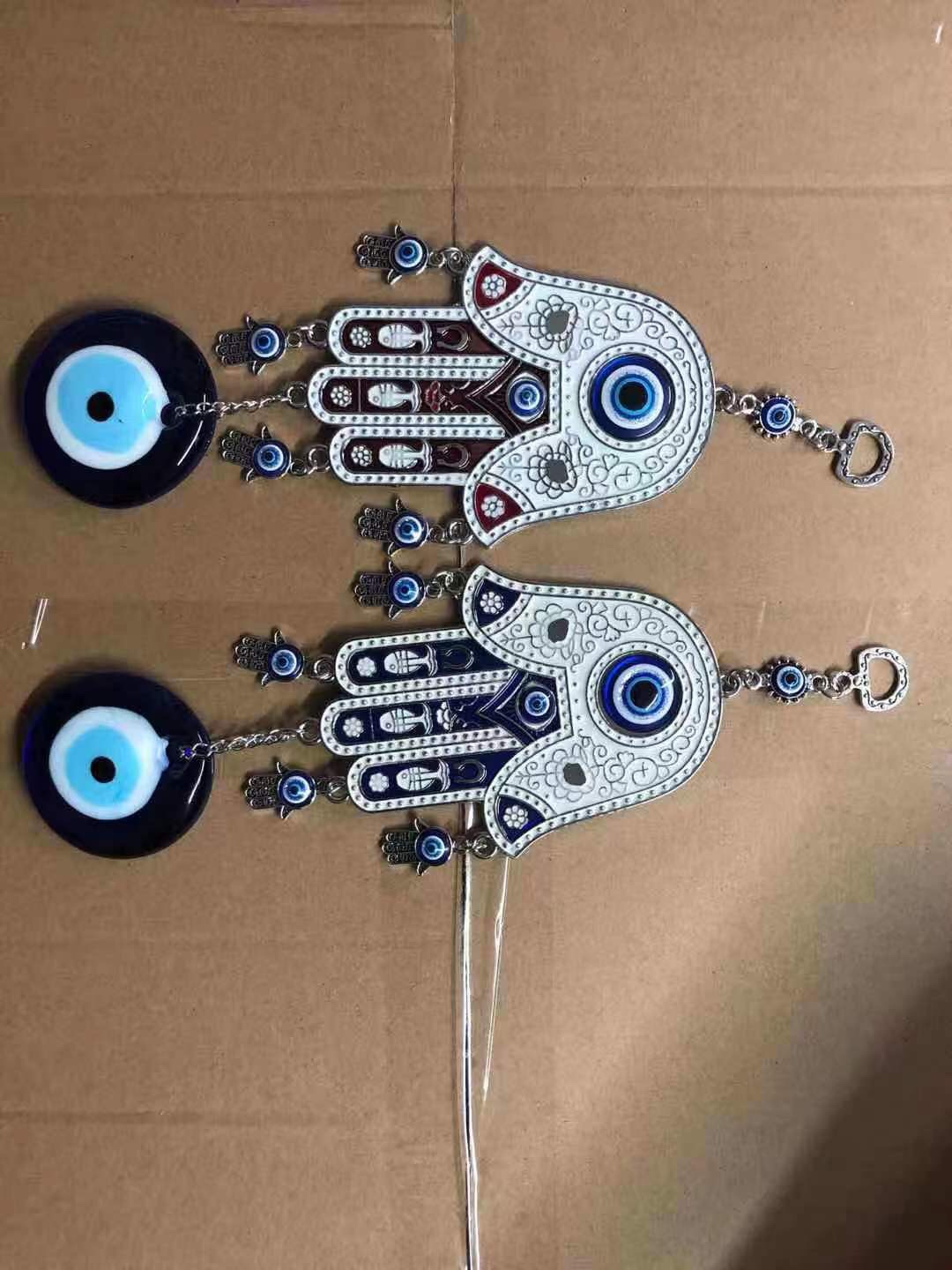 Hand and eye pendants details Picture