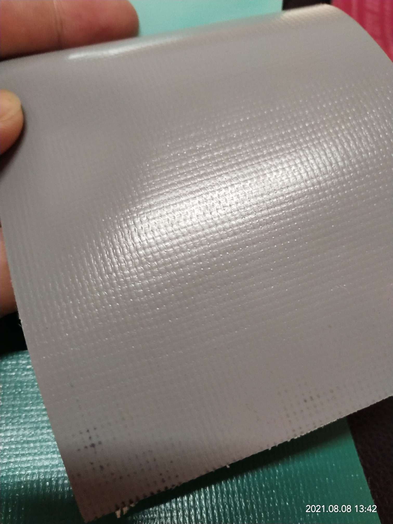 High-quality glossy 0.5mm thick grey PVC mesh fabric for luggage, machine covers, furniture covers, sports and amusement products, and various types of luggage Application Scenario