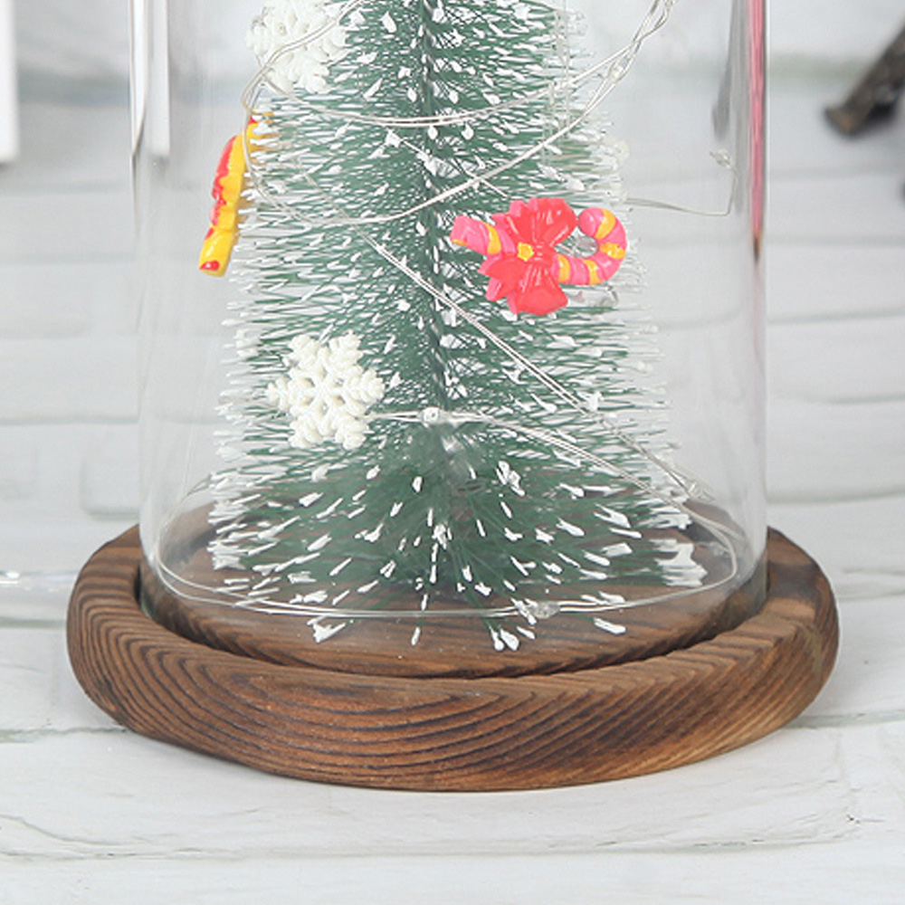 A large artificial Christmas tree with a transparent dust-proof glass cover is a home decoration for the living room and bedroom Specification image