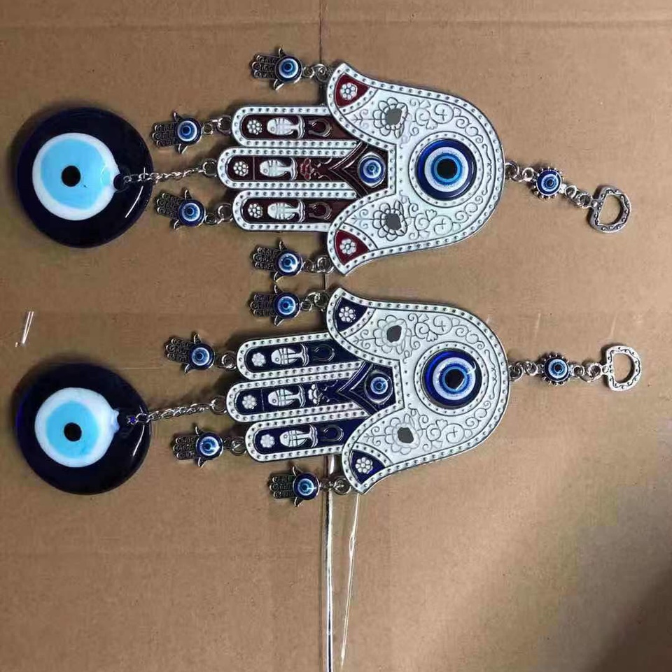 Hand and eye pendants