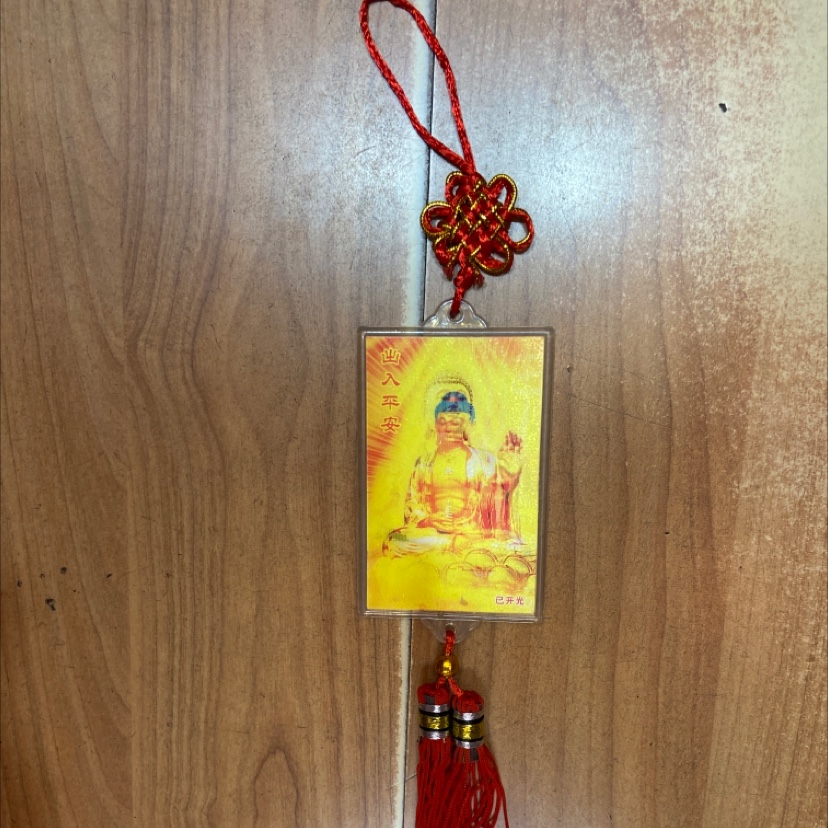 a Pendant rectangular Buddha statue