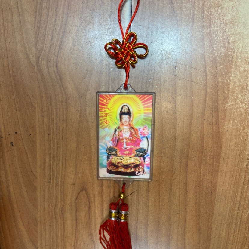 a Pendant rectangle sitting Guanyin