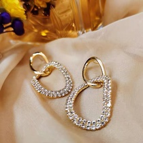 Two-ring interlocking earrings