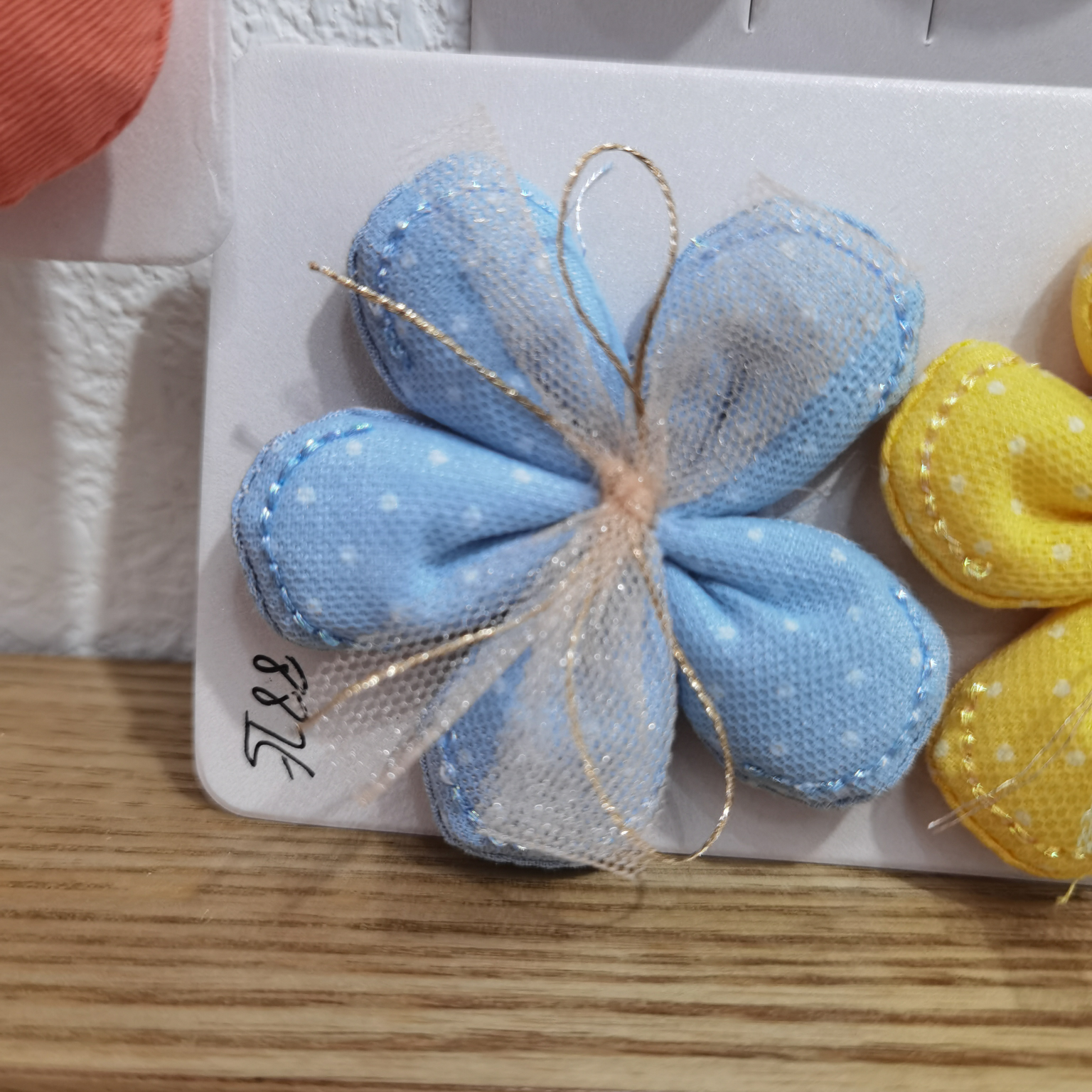 Dotted cotton five-petal flowers with gauze leads in blue