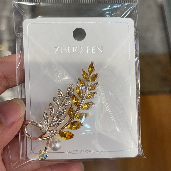 "National Trend series cat's eye stone wheat ear high-end brooch, female Instagram trendy influencer anti-exposure clasp, personalized pin for fixing clothes and accessories.