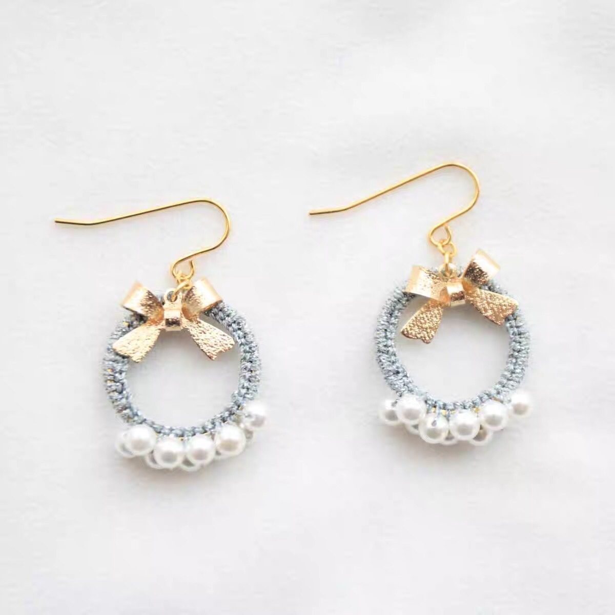 Handwoven sweet pearl bow winter Korean version mid-length earrings