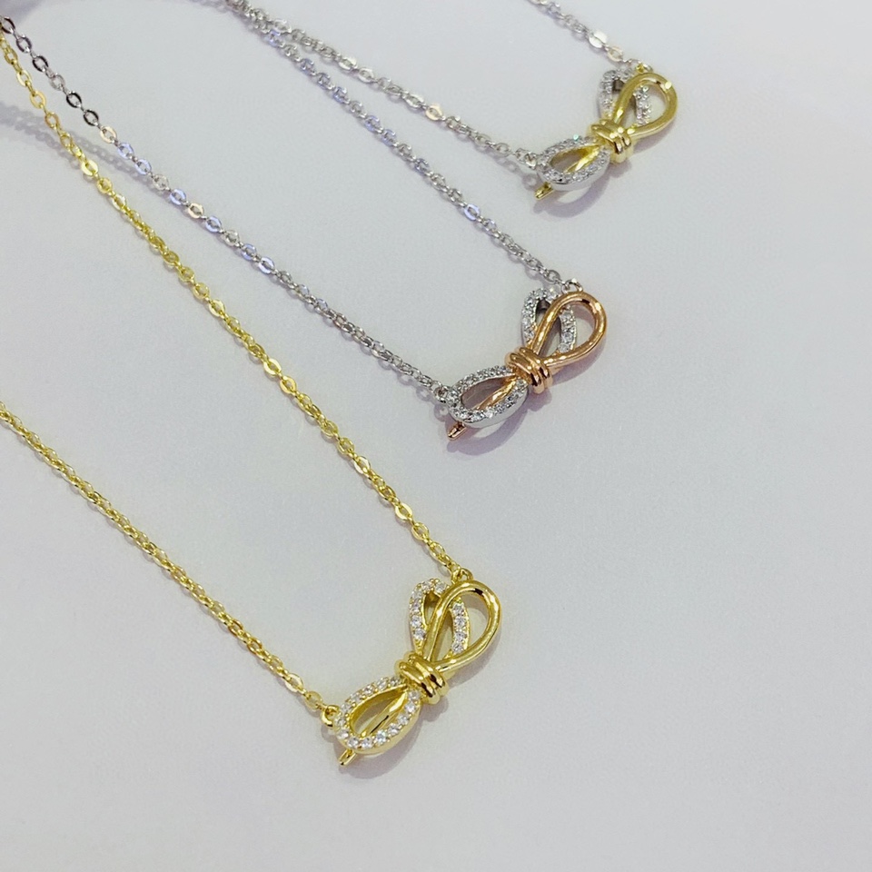 Two-tone bow necklace