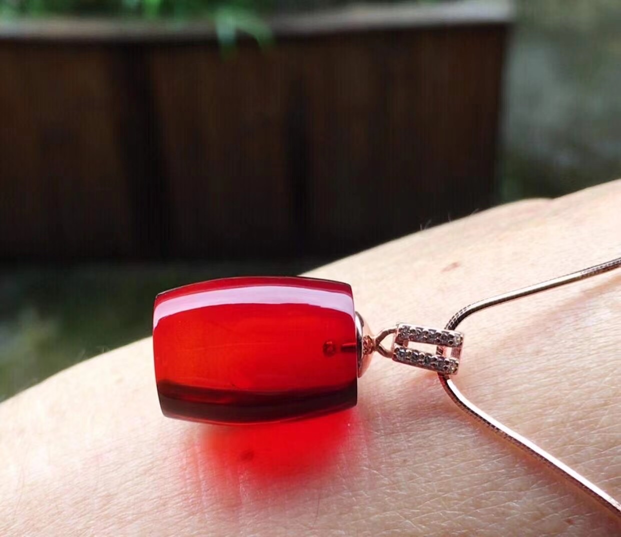 Blood amber cylinder pendant detail image 3