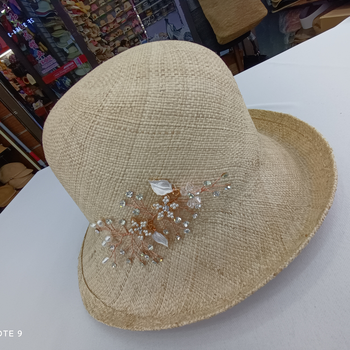 A Straw Hat With Curly Brim