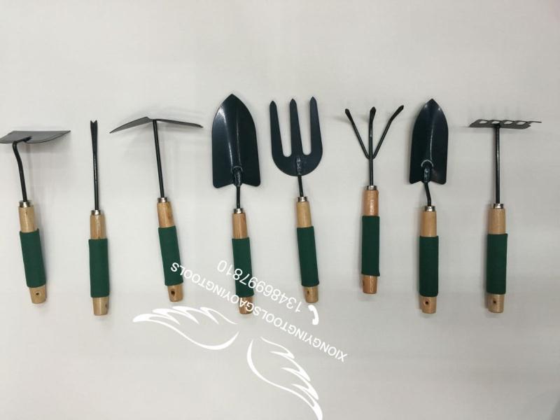 Garden tools Garden tools Garden shovel Garden rake full figure