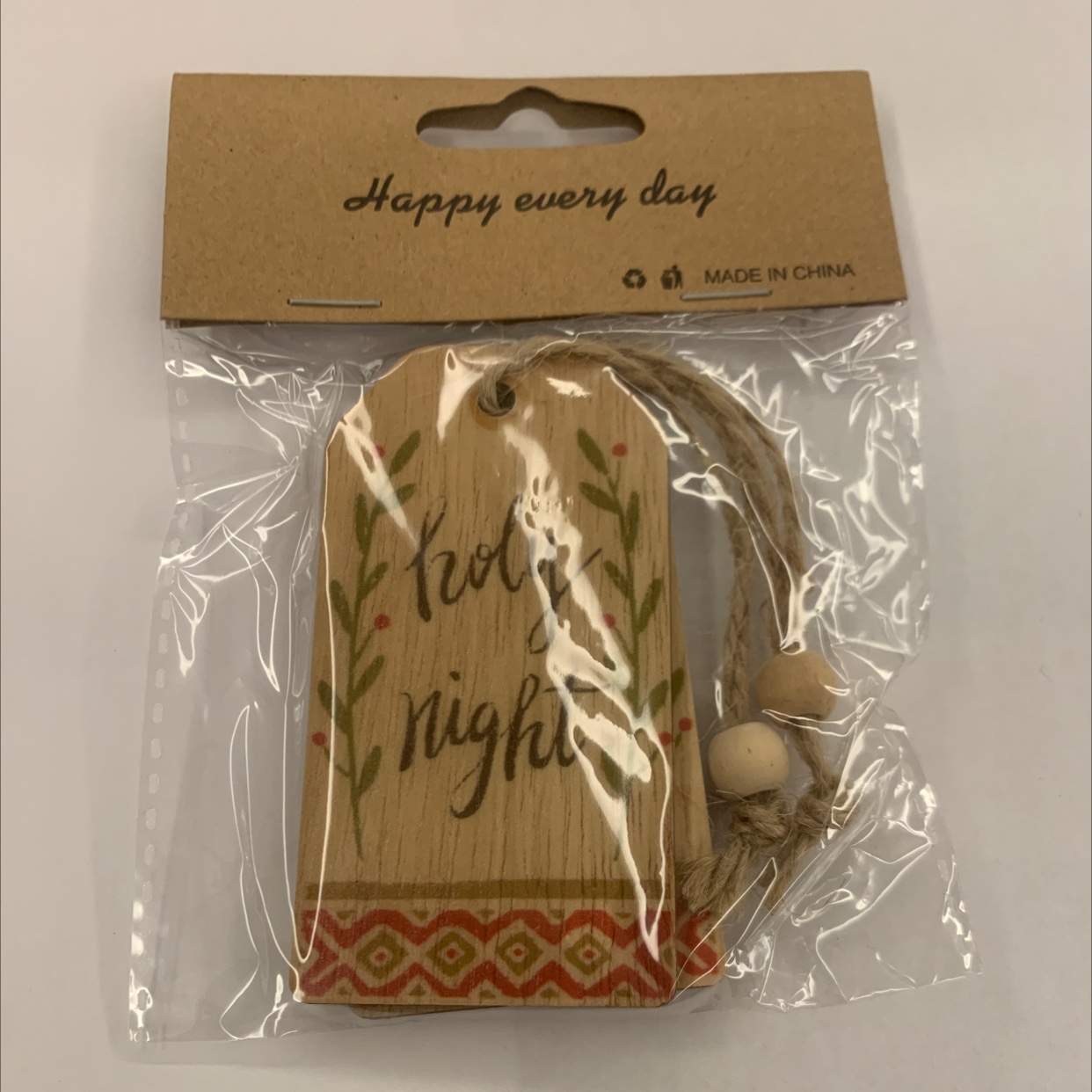 Grey background with color-printed Christmas hemp rope, two strings of natural wood-colored wood beads, one package, gift decoration, wooden 18