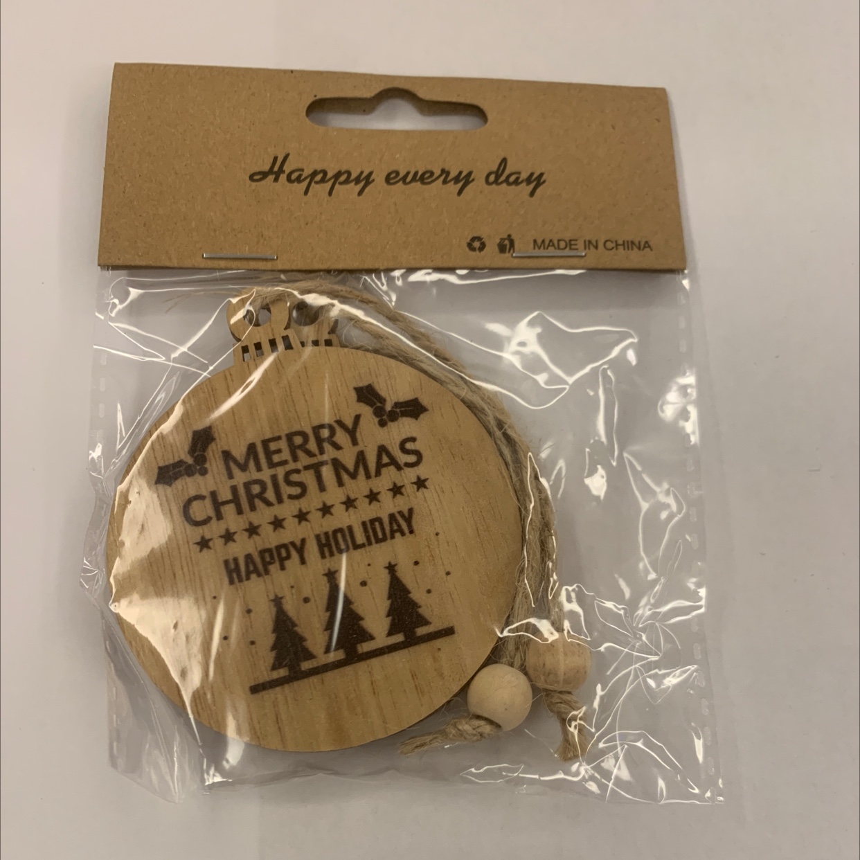 Grey background with color-printed Christmas hemp rope, two strings of natural wood-colored wood beads, one package, gift decoration, wooden 10