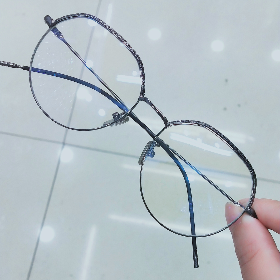A frame with gray eyebrows and detail