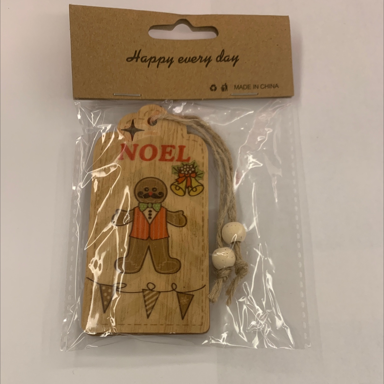 Grey background with color-printed Christmas hemp rope, two strings of natural wood-colored wood beads, one package, gift decoration, wooden 108