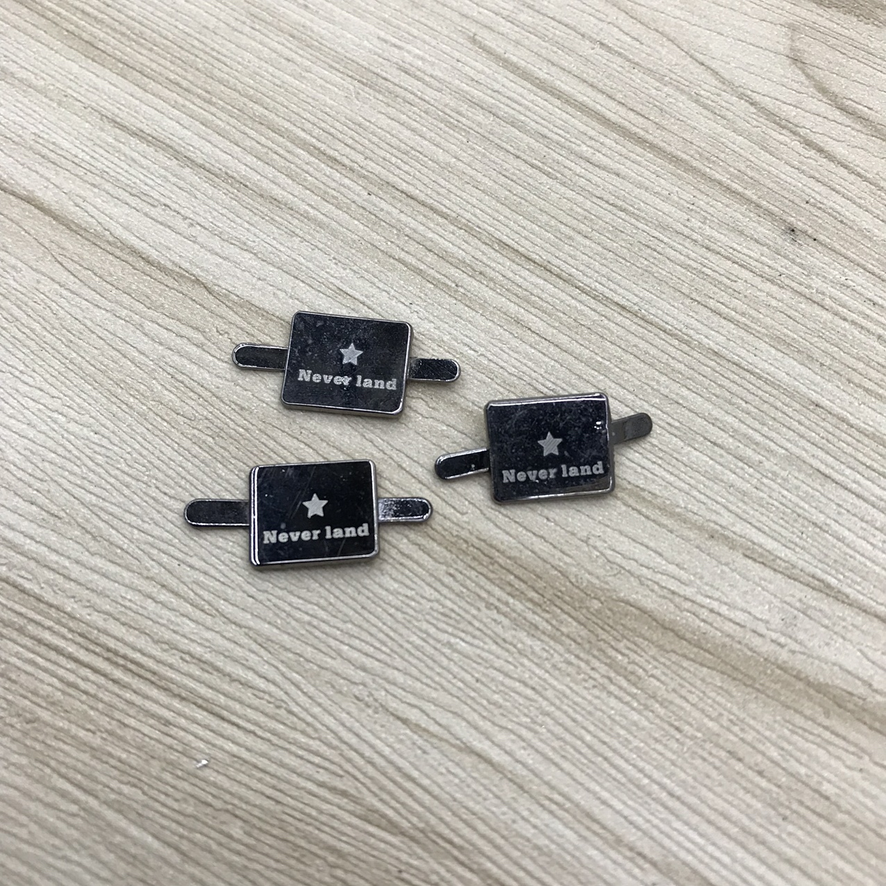 Laser marking of alloy for clothing accessories