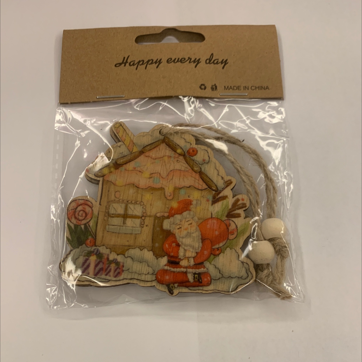 Grey background with color-printed Christmas hemp rope, two strings of natural wood-colored wood beads, one package, gift decoration, wooden 64