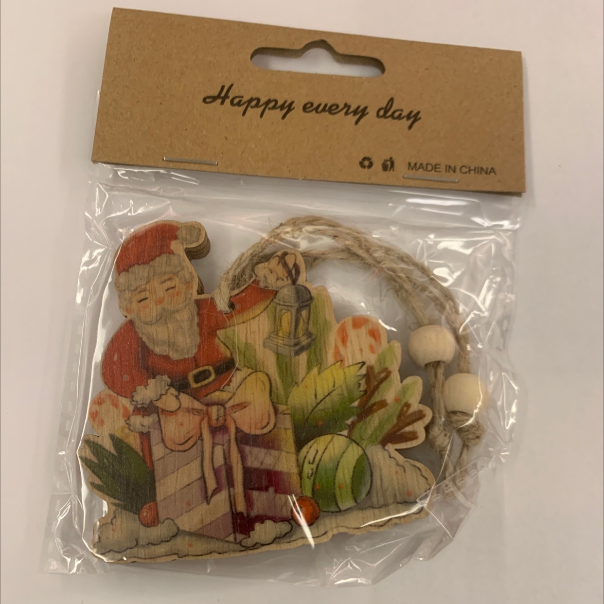 Grey background with color-printed Christmas hemp rope, two strings of natural wood-colored wood beads, one package, gift decoration, wooden 128