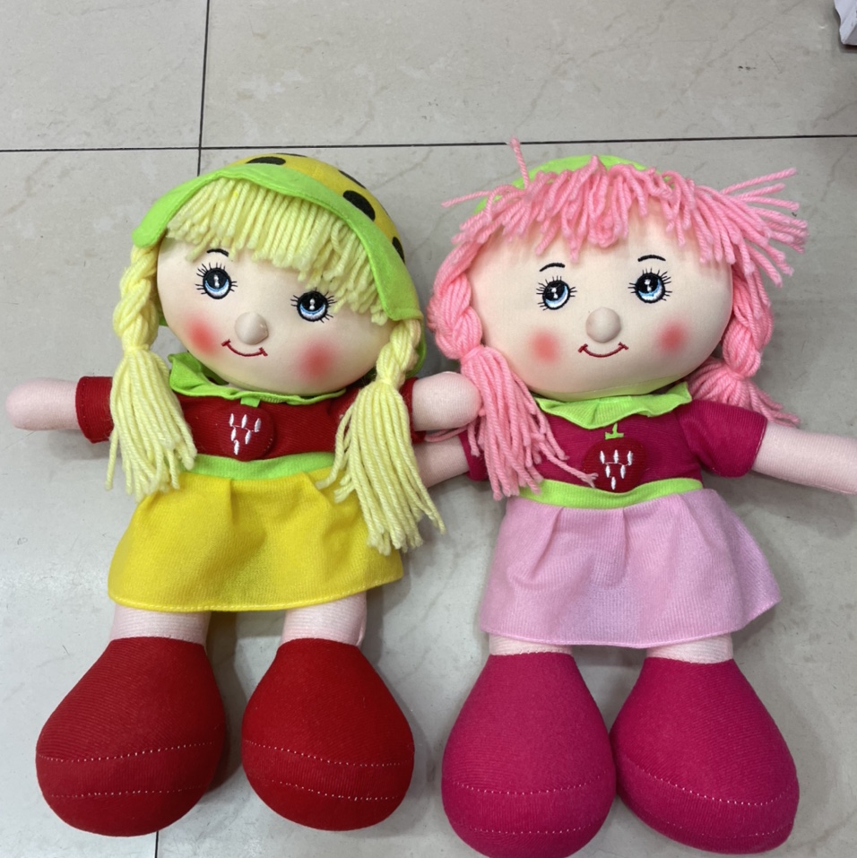 The plush toy plush pillow is the baby's favorite strawberry doll