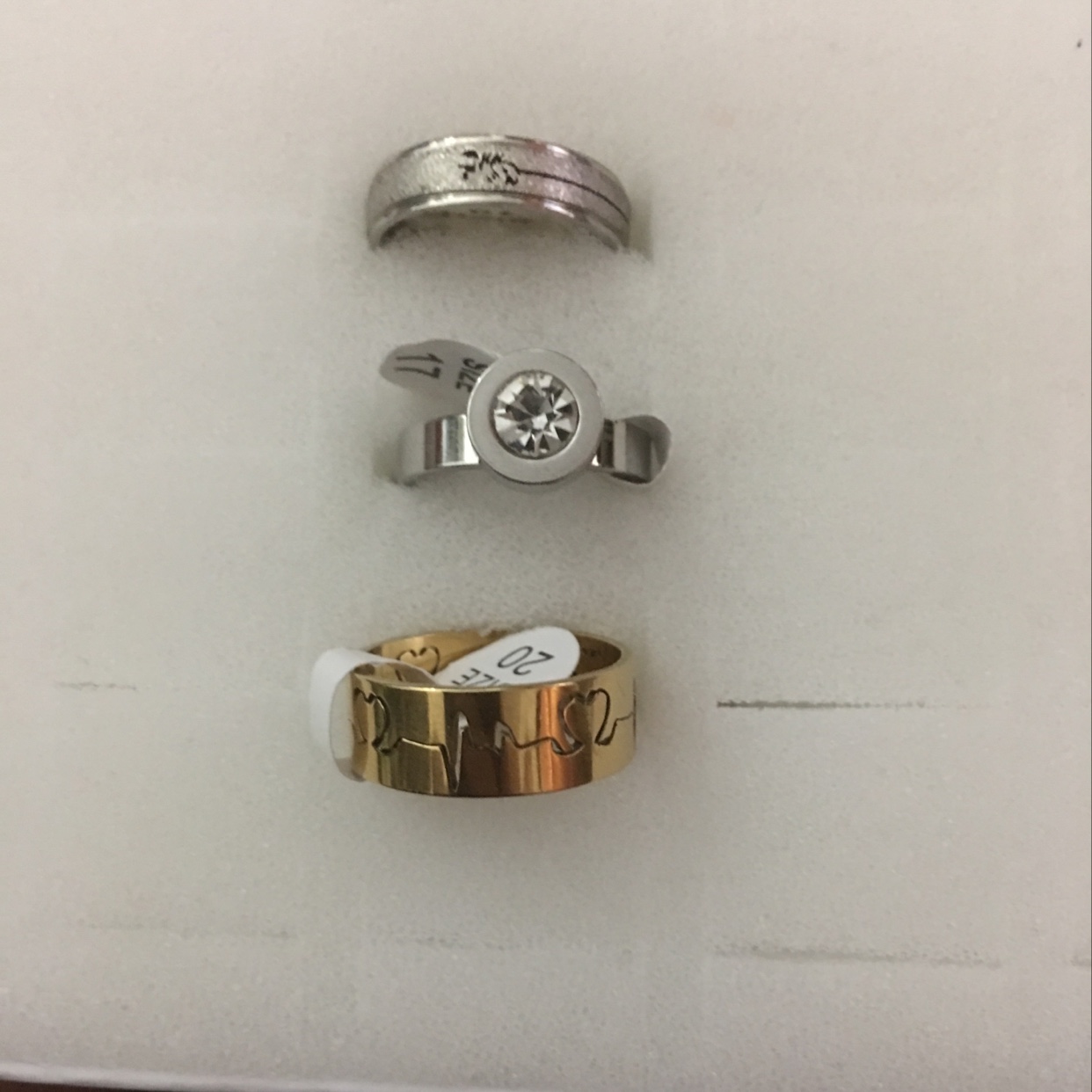 Three laser cut hollowed-out engraving craft design rings with large drill welding smooth ring