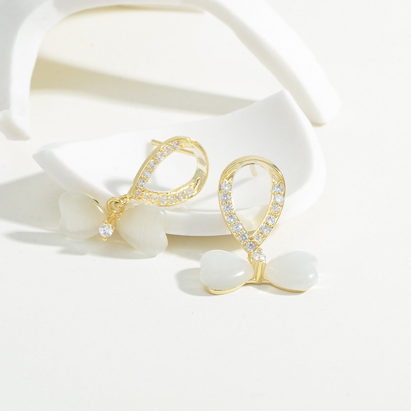 New personality cat's eye earrings Korean version S925 silver needle plated real gold micro plated real gold butterfly stud earrings female